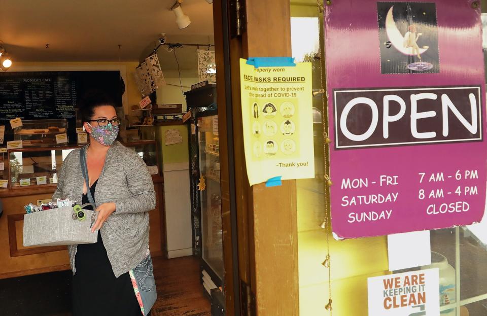 Rachel Finn drops off a box of face coverings at Monica's Waterfront Bakery & Cafe in Old Town Silverdale on Thursday, Sept. 24, 2020. 