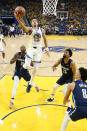 Golden State Warriors guard Jordan Poole (3) shoots against the Dallas Mavericks during the first half of Game 2 of the NBA basketball playoffs Western Conference finals in San Francisco, Friday, May 20, 2022. (AP Photo/Jed Jacobsohn)