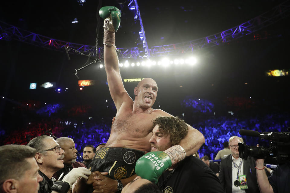 Tyson Fury, of England, celebrates after defeating Deontay Wilder in a WBC heavyweight championship boxing match Saturday, Feb. 22, 2020, in Las Vegas. (AP Photo/Isaac Brekken)
