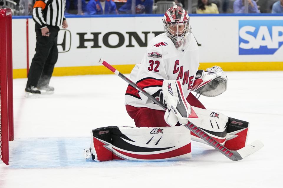 Carolina Hurricanes goaltender Antti Raanta (32) protects his net during the second period of Game 4 of an NHL hockey Stanley Cup first-round playoff series against the New York Islanders, Sunday, April 23, 2023, in Elmont, N.Y. (AP Photo/Frank Franklin II)