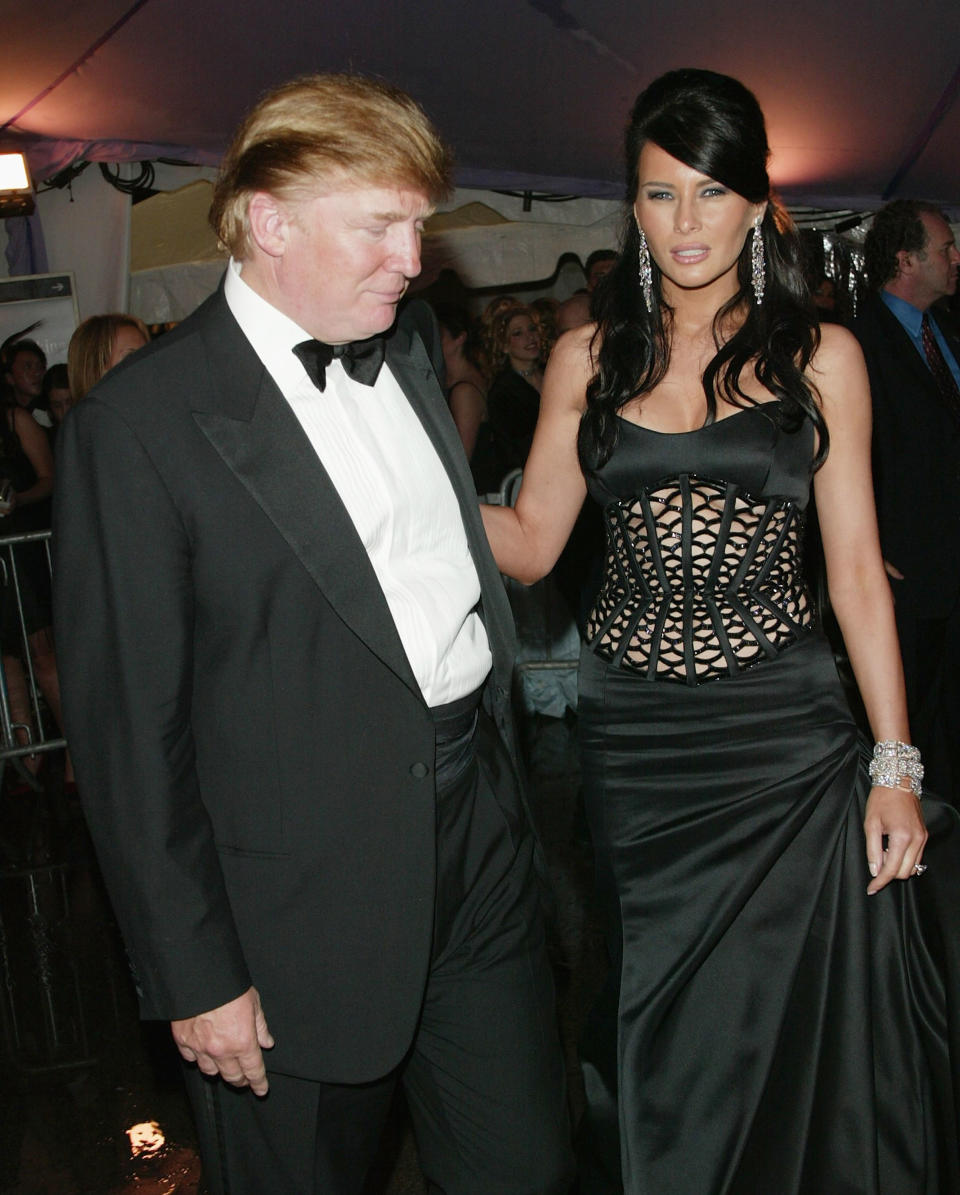 NEW YORK - APRIL 26:  Donald Trump and girlfriend Melania Knauss attend the "Dangerous Liaisons: Fashion and Furniture in the 18th Century" Costume Institute benefit gala on April 26, 2004 at the Metropolitan Museum of Art, in New York City. (Photo by Evan Agostini/Getty Images)