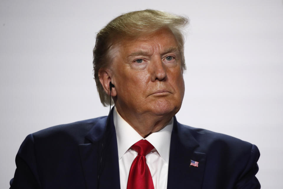 U.S President Donald Trump listens to French President Emmanuel Macron during the final press conference during the G7 summit Monday, Aug. 26, 2019 in Biarritz, southwestern France. (AP Photo/Francois Mori)