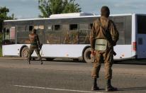 Buses carrying Ukrainian Azovstal service members leave Mariupol