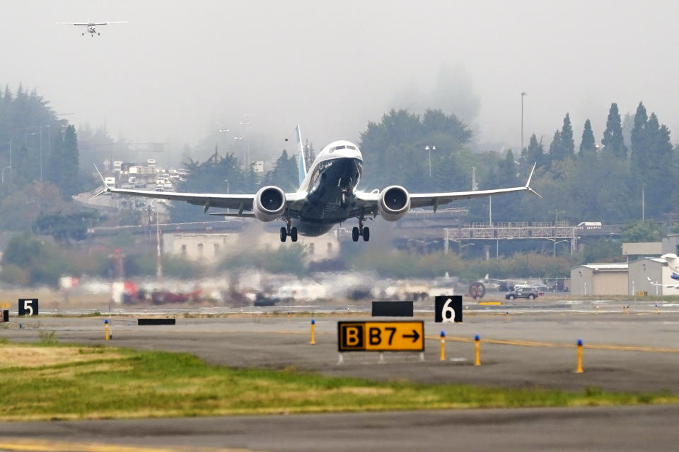 A Boeing 737 MAX jet, piloted by Federal Aviation Administration (FAA) chief Steve Dickson, takes off on a test flight from Boeing Field, Wednesday, Sept. 30, 2020, in Seattle. The MAX was grounded worldwide in early March 2019 after the second of two fatal accidents that together killed 346 people aboard almost-new aircraft. (AP Photo/Elaine Thompson)