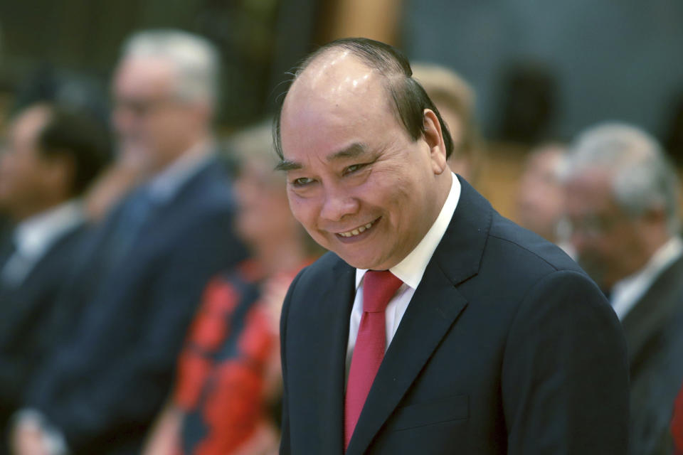 Vietnamese Prime Minister Nguyen Xuan Phuc arrives at the opening ceremony of the 36th ASEAN Summit in Hanoi, Vietnam Friday, June 26, 2020. Leaders from the Southeast Asian ten-nation bloc hold the bi-annual summit via online video conference to discuss regional issues. (AP Photo/Hau Dinh)