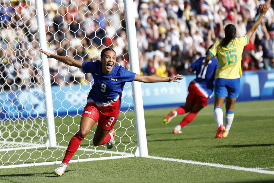 United States striker Mallory Swanson celebrates after scoring the lone goal during the women's soccer gold medal match between Brazil and the U.S. (AP Photo/Aurelien Morissard)