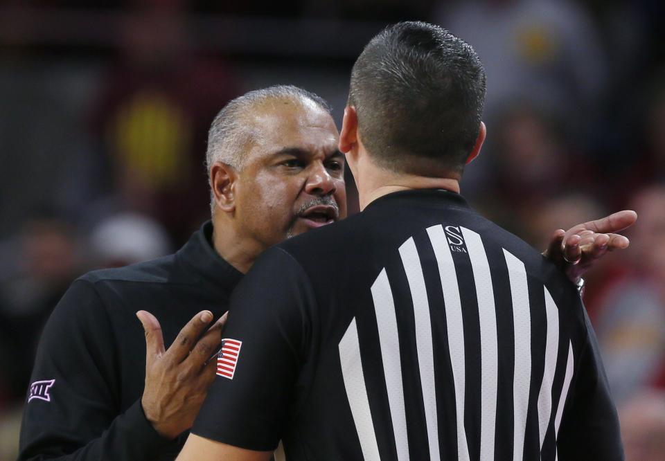 Kansas State coach Jerome Tang, left, reacts with an official after a call during the second half of Wednesday's Big 12 game against Iowa at Hilton Coliseum in Ames, Iowa.