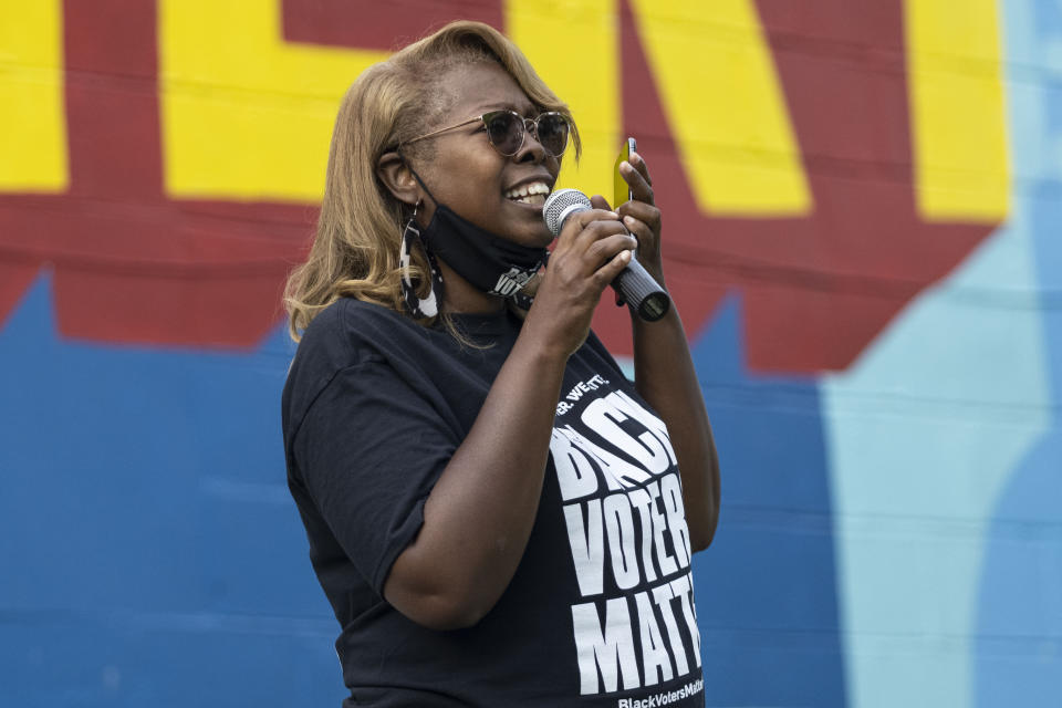 LaTosha Brown, co-founder of Black Voters Matter, speaks on voting rights at the John Lewis Advancement Act Day of Action, a voter education and engagement event, Saturday, May 8, 2021, at King's Canvas in Montgomery, Ala. (AP Photo/Vasha Hunt)