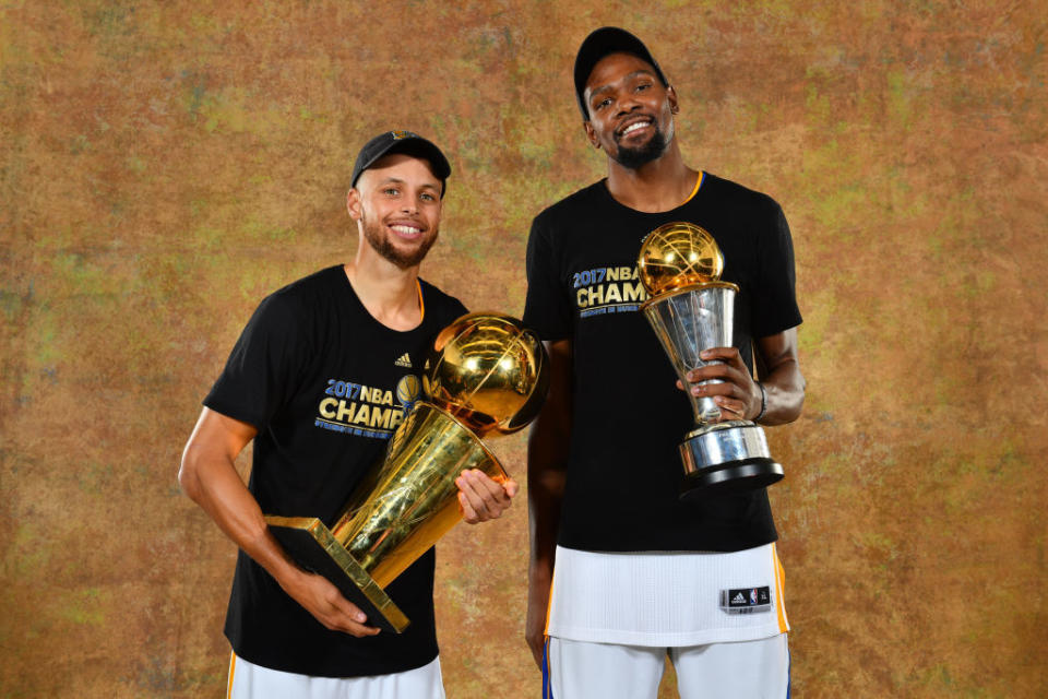 Stephen Curry and Kevin Durant show the fruits of their labors. (Jesse D. Garrabrant/NBAE/Getty Images)