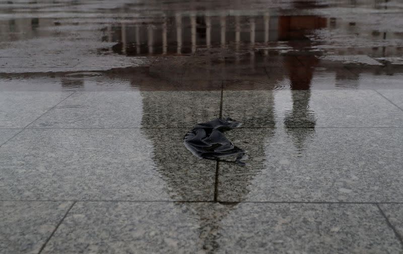 An abandoned mask is seen on the ground in front of the U.S. Capitol building in Washington
