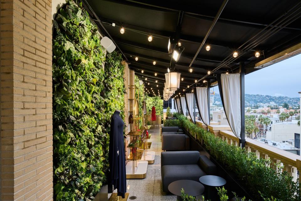 a room with a balcony and a view of a city