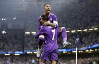 <p>Real Madrid’s Cristiano Ronaldo celebrates scoring their first goal with Sergio Ramos </p>