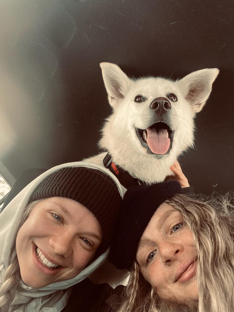 Em Oates, right, with her friend Heather Goosney and her dog Moon, on their way hiking. 