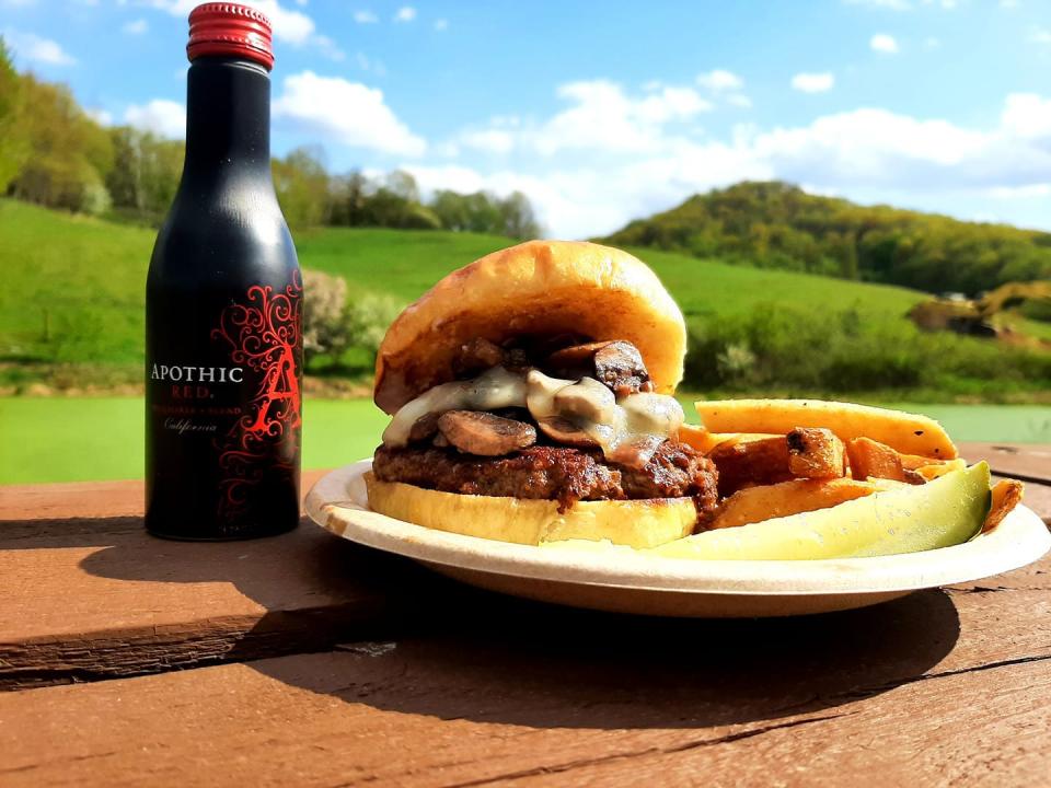 One of Together Farms' Burger of the Week specials was a mushroom and swiss burger with mushrooms and garlic that were sauteed in a red wine and topped with melted Swiss cheese.