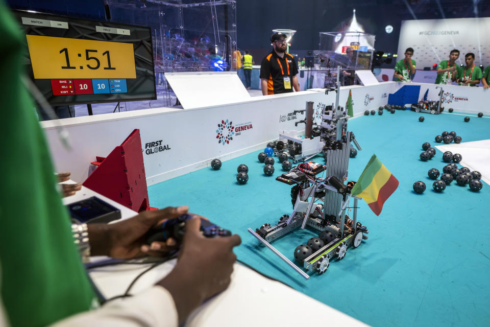 Robots from different teams compete during the 6th edition of the First Global Robotics Challenge in Geneva, Switzerland, Saturday, Oct. 15, 2022. (Martial Trezzini/Keystone via AP)