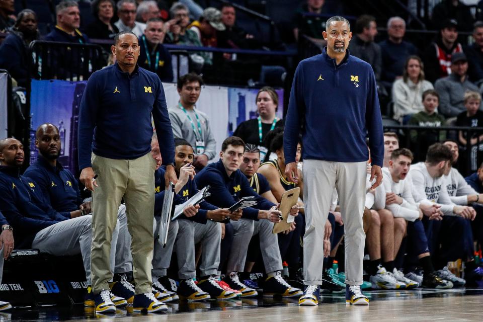 Michigan head coach Juwan Howard and assistant coach Howard Eisley watch a play against Penn State during the first half of the First Round of Big Ten tournament at Target Center in Minneapolis, Minn. on Wednesday, March 13, 2024.