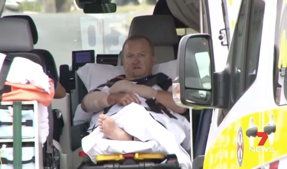 Ian Fraser was left bloodied and bandaged after breaking up a dog fight. Source: 7 News