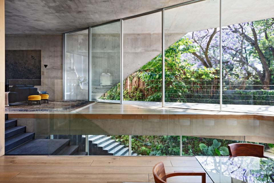 At a Latin American house designed by BIG–Bjarke Ingels Group, a central skylit stair creates a kind of internal fault line.