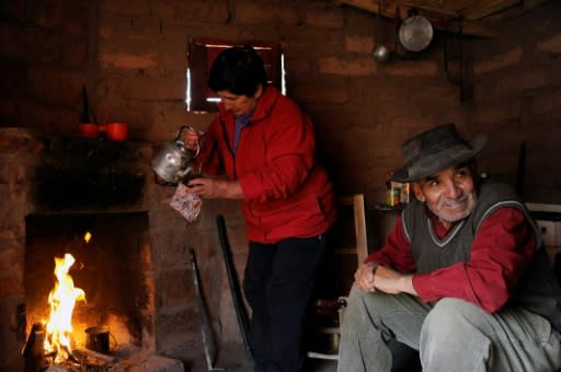 Goat-breeder Antonio Sazo and his wife Rosa drink mate in El Alambrado in the south of Argentina's Mendoza province