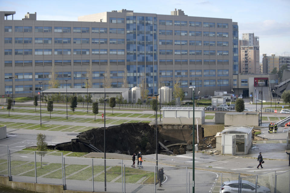 A view of the large sinkhole that opened overnight in the parking of Ospedale del Mare hospital in Naples, Italy, Friday, Jan. 8, 2021. (Alessandro Pone/LaPresse via AP)
