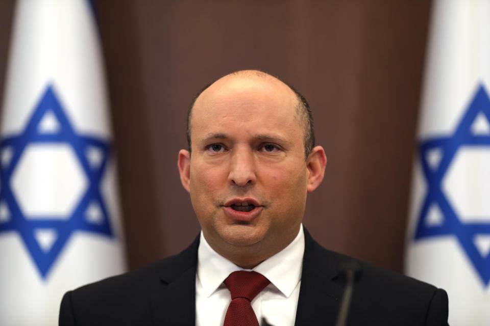 FILE - Israeli Prime Minister Naftali Bennett speaks during a cabinet meeting at the prime minister's office in Jerusalem, Israel, Dec. 19, 2021. Bennett is flying to the Gulf state of Bahrain on Monday, Feb. 14, 2022. His trip cements ties between the new allies in a clear message of cooperation to regional archrival Iran. Bennett’s trip to the Gulf is the first public visit by an Israeli leader to Bahrain and comes less than two weeks after the countries signed a defense agreement with an eye on rising tensions in the Gulf. (Abir Sultan/Pool Photo via AP, File )