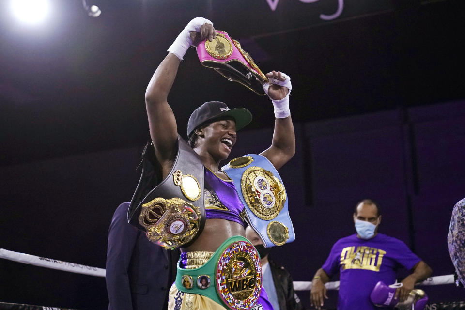 FILE - In this March 5, 2021, file photo, Claressa Shields holds her championship belts after defeating Marie-Eve Dicaire by decision for the women's super welterweight boxing title in Flint, Mich. Shields did it all in boxing. Two-time Olympic gold medalist. Professional titles in three weight classes. Now she'll try to conquer MMA, starting with her pro debut for Professional Fighters League on Thursday night, June 10, 2021, in Atlantic City, N.J. (AP Photo/Carlos Osorio, File)