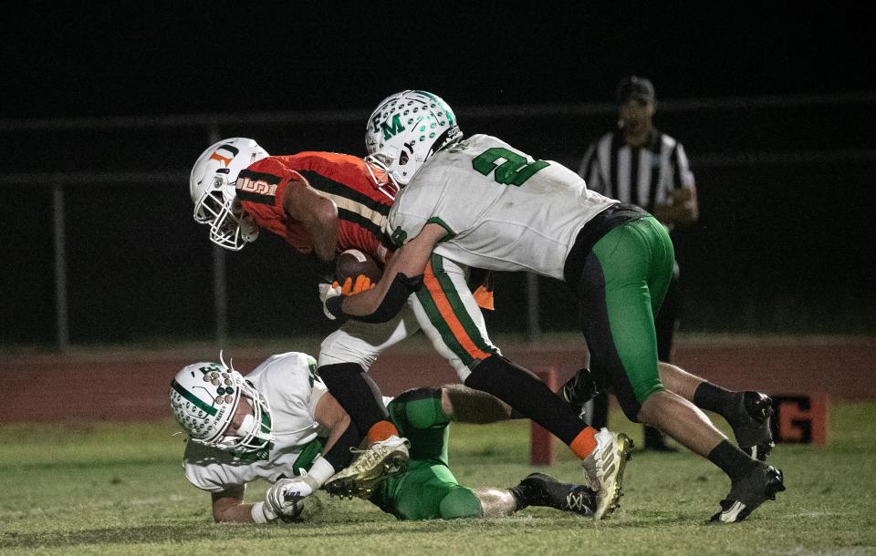 Camden Rivera of Dunbar makes a catch to set up a Dunbar touchdown in the 3S regional quarterfinals on Friday, Nov. 10, 2023, at Dunbar High School in Fort Myers.