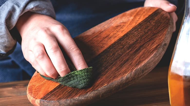 Wiping wooden cutting board