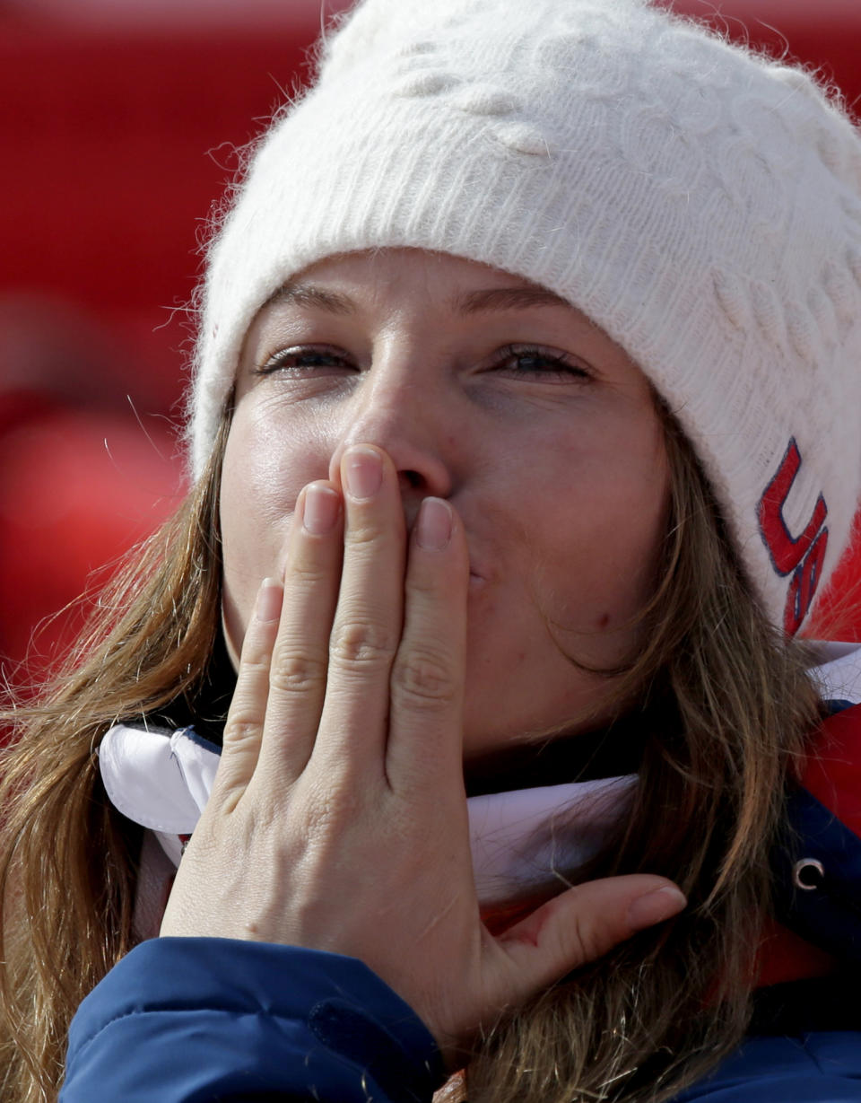 United States' Julia Mancuso blows a kiss as she leaves the finish area after the downhill portion of the women's supercombined at the Sochi 2014 Winter Olympics, Monday, Feb. 10, 2014, in Krasnaya Polyana, Russia. (AP Photo/Gero Breloer)