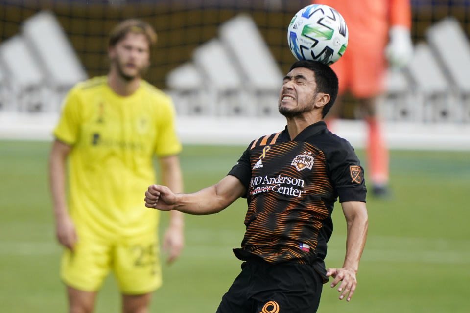 Houston Dynamo midfielder Memo Rodriguez heads the ball during the first half of an MLS soccer match against Nashville SC Saturday, Sept. 26, 2020, in Nashville, Tenn. (AP Photo/Mark Humphrey)