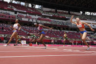 Jasmine Camacho-Quinn, left, of Puerto Rico, wins the women's 100-meters hurdles final at the 2020 Summer Olympics, Monday, Aug. 2, 2021, in Tokyo. (AP Photo/David J. Phillip)