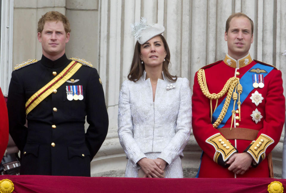 Prince Harry, Catherine Duchess of Cambridge and Prince William Duke of Cambridge stand on the balcony during Trooping the Colour at The Royal Horseguards on June 14, 2014 in London, England.