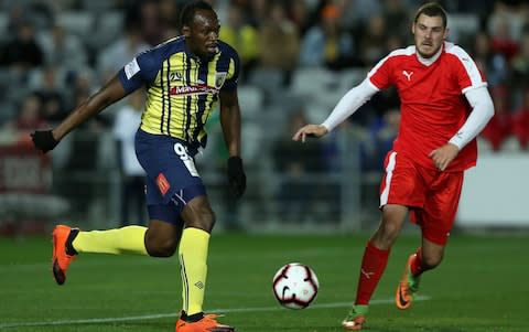 Usain Bolt playing football - Credit: Ashley Feder/Getty Images