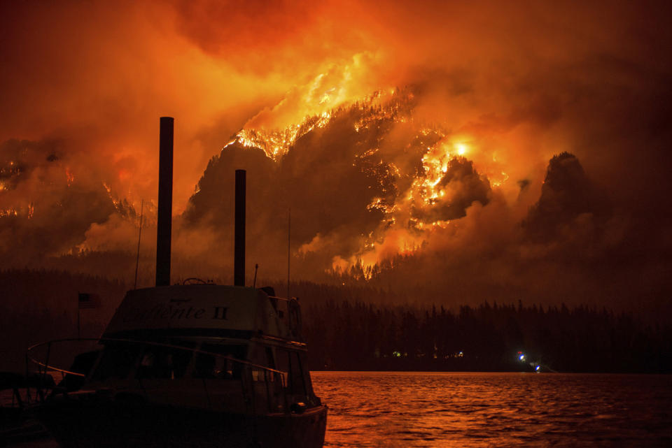 <p>Wildfire as seen from near Stevenson Wash., across the Columbia River, burning in the Columbia River Gorge above Cascade Locks, Ore., Sept. 4, 2017. (Photo: Tristan Fortsch/KATU-TV via AP) </p>