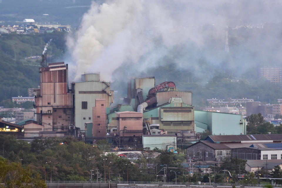 Smoke billows from the facilities of Mitsubishi Steel Muroran Inc