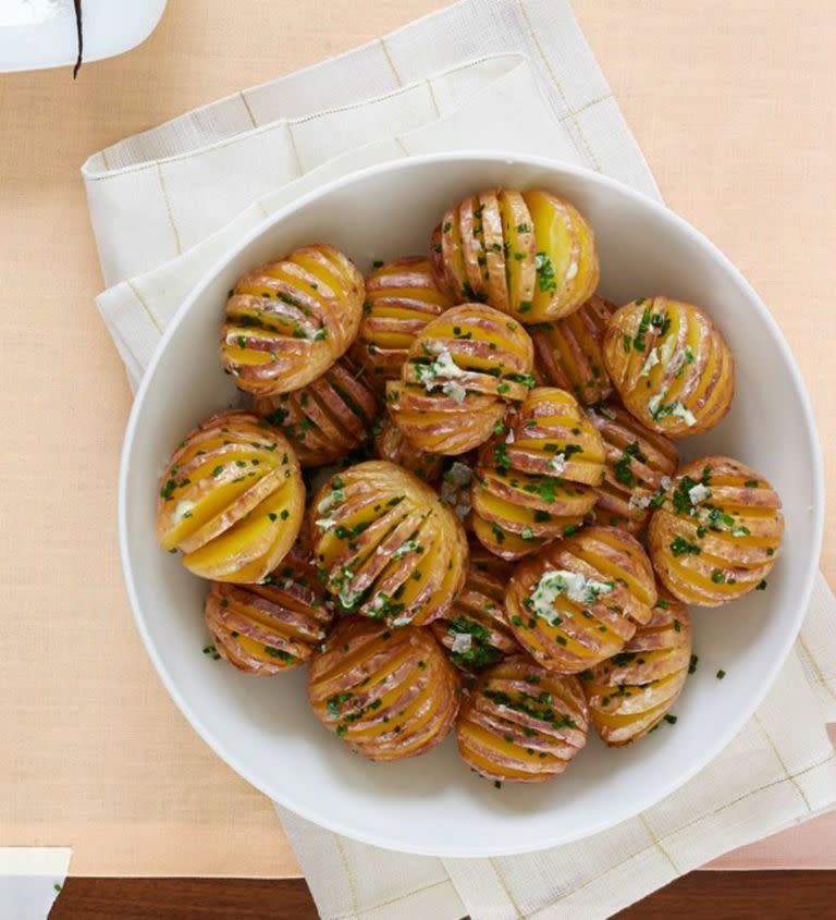 <p>You're going to want to make at least two servings of these potatoes because once your family tries one, they're going to want them all. They won't even realize it's a vegetarian dish. </p><p><em>Get the <a href="https://www.womansday.com/food-recipes/food-drinks/recipes/a53986/mini-hasselback-potatoes-with-chive-butter-recipe/" rel="nofollow noopener" target="_blank" data-ylk="slk:Mini Hasselback Potatoes with Chive Butter recipe;elm:context_link;itc:0;sec:content-canvas" class="link ">Mini Hasselback Potatoes with Chive Butter recipe</a>.</em></p>