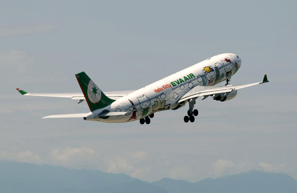 An Airbus A330-300 aircraft of Taiwan's Eva Airlines, decorated with Hello Kitty motifs, takes off from Taoyuan International Airport, northern Taiwan to Sapporo, Japan, April 30, 2012. Taiwan's second-largest carrier, Eva Airlines, and Japan's comic company, Sanrio, which owns the Hello Kitty brand, collaborated on the second generation Hello Kitty-themed aircraft which was launched on October 2011. There are currently three Hello Kitty-themed Airbus A330-300 aircrafts flying between cities such as Taipei, Fukuoka, Narita, Sapporo, Incheon, Hong Kong and Guam. REUTERS/Pichi Chuang