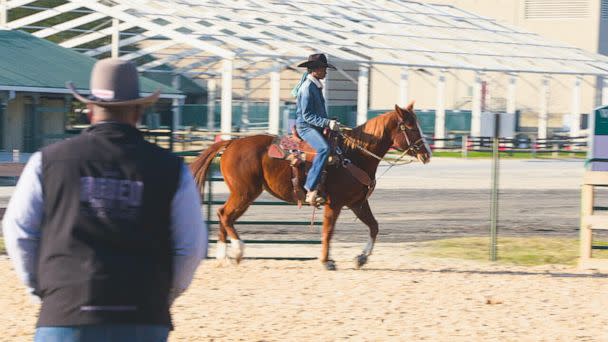 PHOTO: Corey Jackson watches Reagan Jackson train with horse Sunday. (Courtesy of ABC News/GMA)