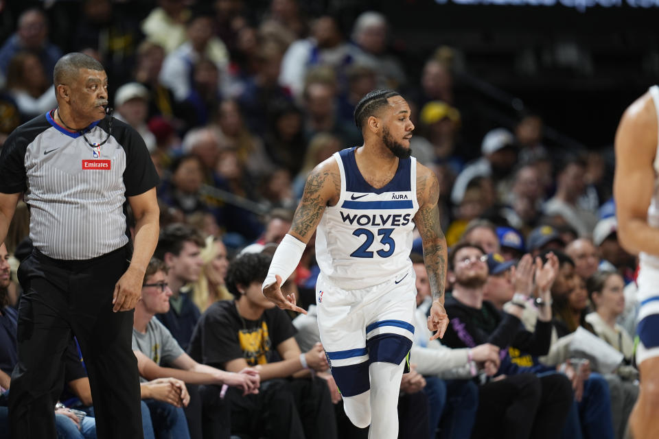 Minnesota Timberwolves guard Monte Morris grestures after hitting a 3-point basket against the Denver Nuggets during the first half of an NBA basketball game Wednesday, April 10, 2024, in Denver. (AP Photo/David Zalubowski)