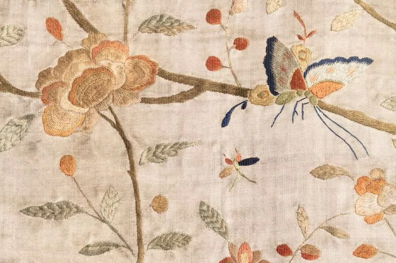 The State Bed's white silk fabrics, embroidered with birds, flowers and insects, influenced the bug hall's design