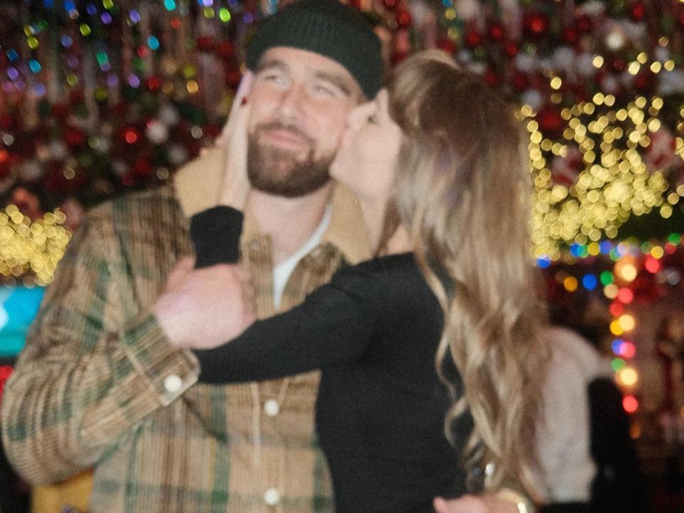 Taylor Swift pictured giving Travis Kelce a kiss on the cheek (@patty_cuts on Instagram)