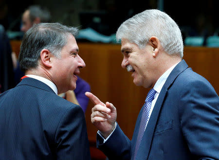 Spain's new Foreign Minister Alfonso Dastis (R) attends a European Union foreign ministers meeting in Brussels, Belgium November 14, 2016. REUTERS/Yves Herman