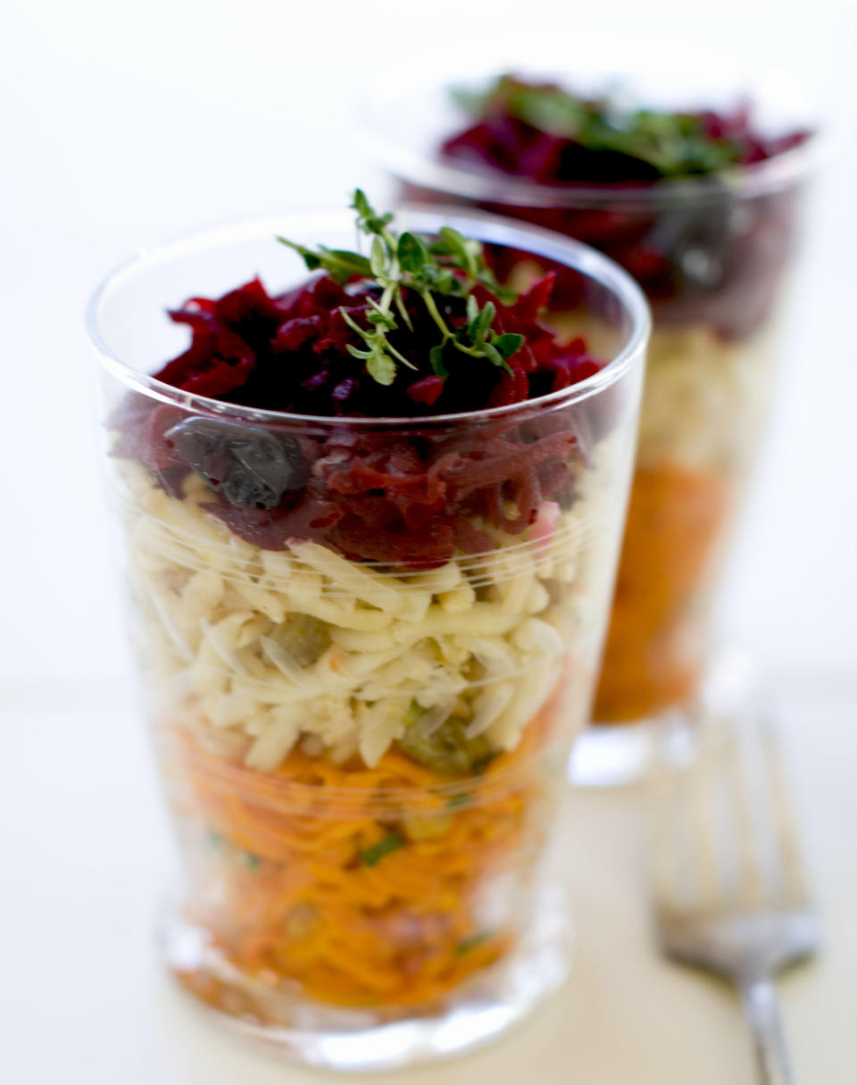 This Nov. 18, 2013 photo shows, from top, shredded beets with balsamic, shredded parsnips with walnuts, and shredded spicy carrots, in Concord, N.H. (AP Photo/Matthew Mead)