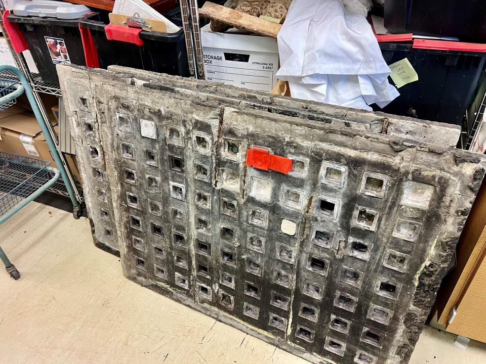 Grids of purple glass blocks salvaged from sidewalk repairs downtown are being stored in the city of Salem's archaeology lab. The glass blocks illuminated basement vaults that extended under the sidewalk.