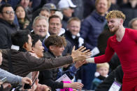 Liverpool's Harvey Elliott shakes hands with fans at the end of the English Premier League soccer match between Fulham and Liverpool at Craven Cottage stadium in London, Sunday, April 21, 2024. (AP Photo/Kirsty Wigglesworth)