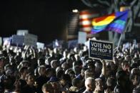 Supporters gather during a "No on Prop 8" rally in West Hollywood California November 5, 2008. Opponents of Proposition 8 gathered to criticize the passage of the initiative defining marriage as between one man and one woman. California and two other states voted in Tuesday's elections to ban same-sex marriage, overturning a right given to gays and lesbians in the liberal, trend-setting state just months ago in state court.