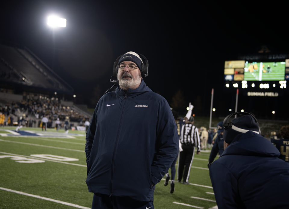 University of Akron coach Joe Moorhead takes in the scene with five seconds left on the clock in a Zips victory over Kent State on Wednesday night in Akron.