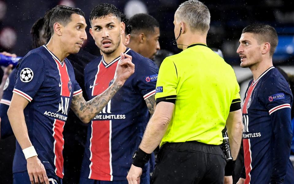 PSG's Angel Di Maria (L) reacts after receiving a red card from Dutch referee Bjorn Kuipers (2-R) during the UEFA Champions League semi final, second leg soccer match between Manchester City and Paris Saint-Germain in Manchester, Britain, 04 May 2021.  - PETER POWELL/EPA-EFE/Shutterstock