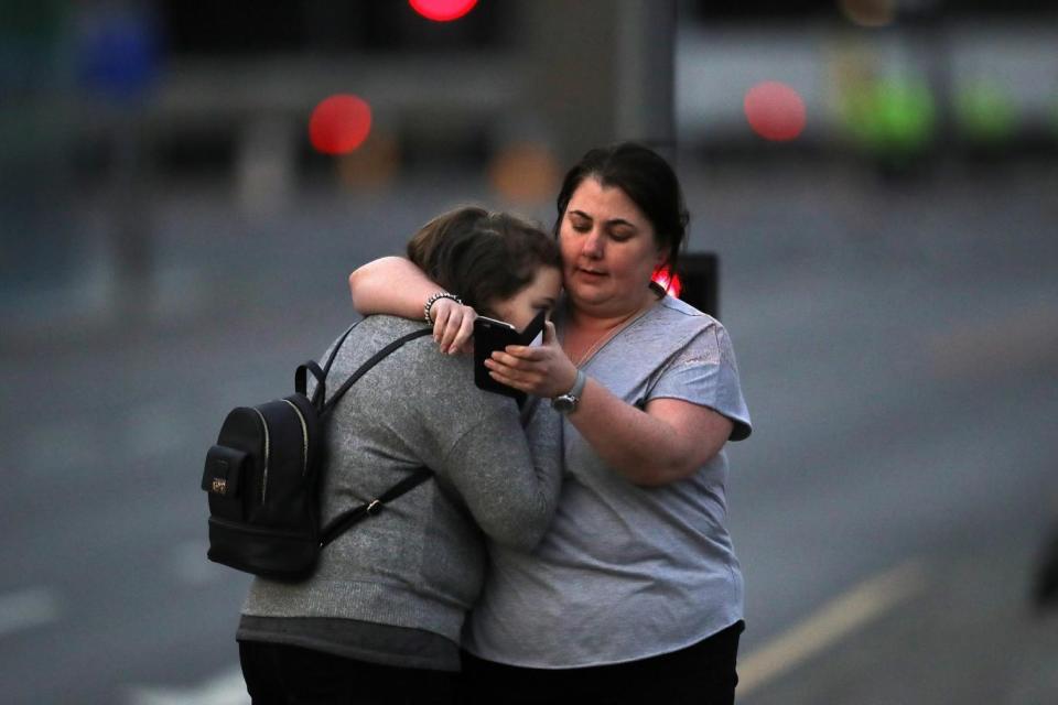 People comfort each other following the attack in Manchester (Getty Images)