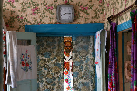 An icon is seen in a house of 82-year-old Yulia Panchenya in the village of Pogost, Belarus, April 15, 2017. REUTERS/Vasily Fedosenko